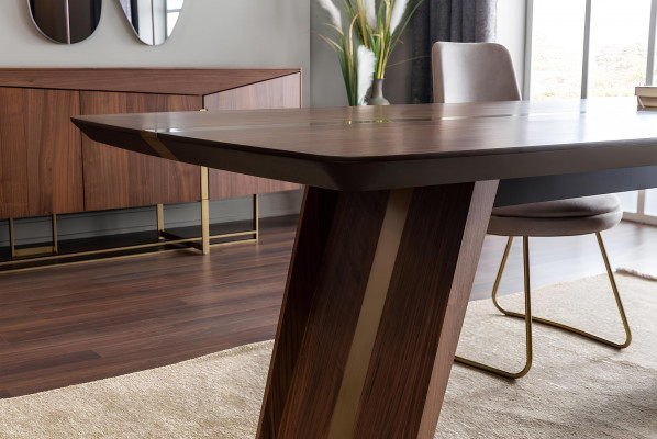 Brown dining table with 9 chairs and a nightstand