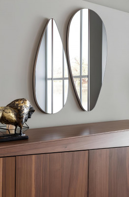 Brown dining table with 9 chairs and a nightstand