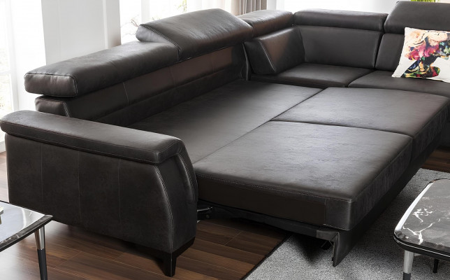 Black L-shaped sofa with bed function