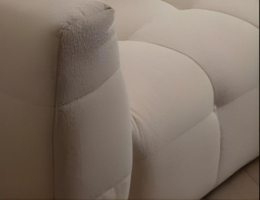 Elegant L-shaped corner sofa with modern 2-piece pouf