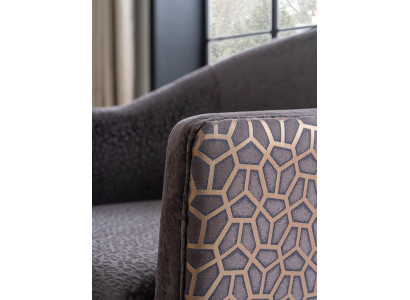 Padded club chair with armrest