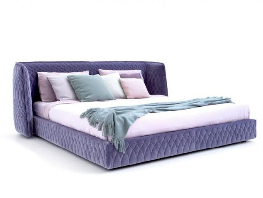 Bed in modern blue velvet design with elegant headboard