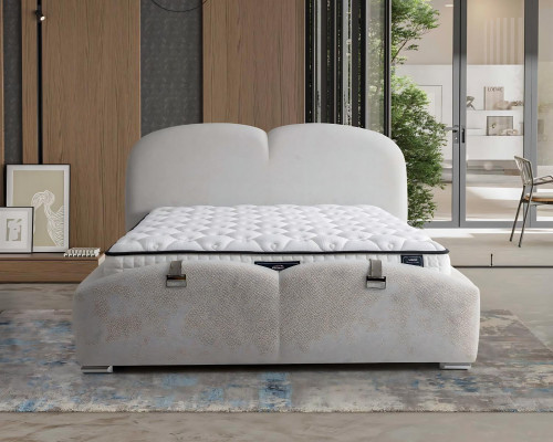Modern white bed with upholstery and wooden mattress
