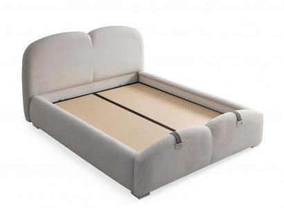 Modern white bed with upholstery and wooden mattress