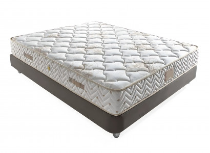 Elegant bed with light gray fabric and wooden pillows