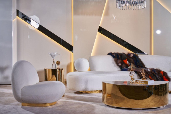 Luxurious white living room set with 3-seater, armchair, round coffee table.