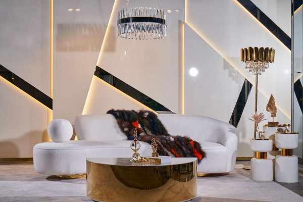 Luxurious white living room set with 3-seater, armchair, round coffee table.