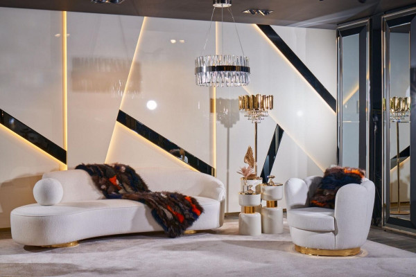 Luxurious white living room set with 3-seater, armchair, round coffee table.