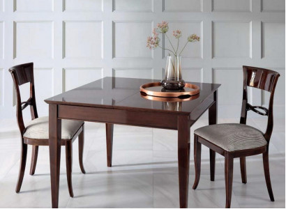 Elegant dining table with chairs in dark brown color with a glossy finish