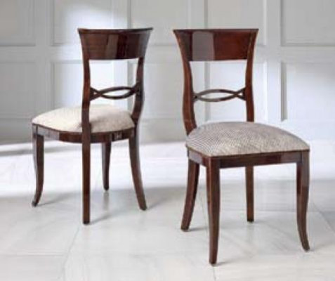 Elegant dining table with chairs in dark brown color with a glossy finish