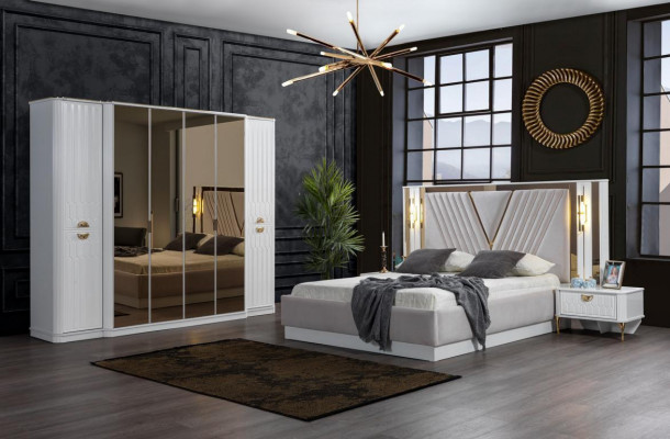 2-bedroom bed with gold embellishments and matching nightstands