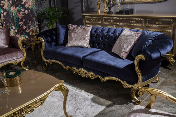 Chesterfield three-seater sofa in luxurious blue color for the living room