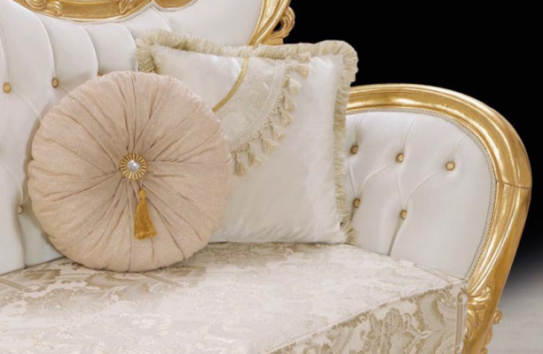 A luxurious and relaxing sofa in a classic style with golden patterns.
