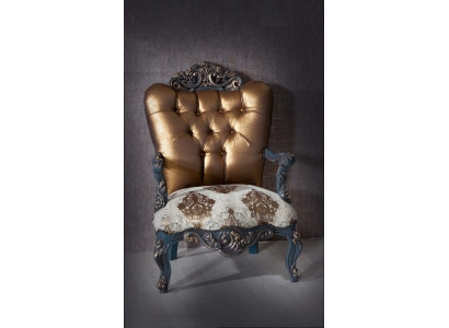 Chesterfield design armchair with a golden backrest for the living room