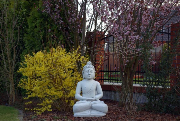 Buddha sculpture with a stone look. Decorative large sculpture for garden figure