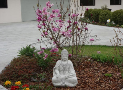 Buddha sculpture in stone look. Large statue figure for garden decoration.