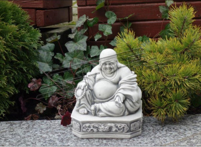 Buddha sculpture with a stone look. Large decorative sculpture for garden figure.