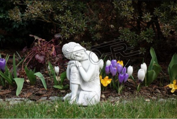 Decorative Buddha sculpture in stone look. Large figure sculpture for the garden.