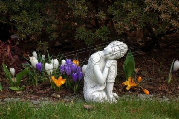 Decorative Buddha sculpture with a stone look. Large sculpture for garden figure.