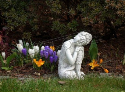 Decorative Buddha sculpture with a stone look. Large sculpture for garden figure.