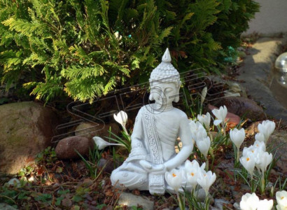 Decorative Buddha sculpture in stone look. Large sculpture for the garden.