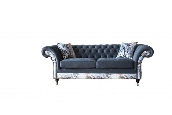 A striking three-seater sofa in Chesterfield design with delicate gray floral decoration.