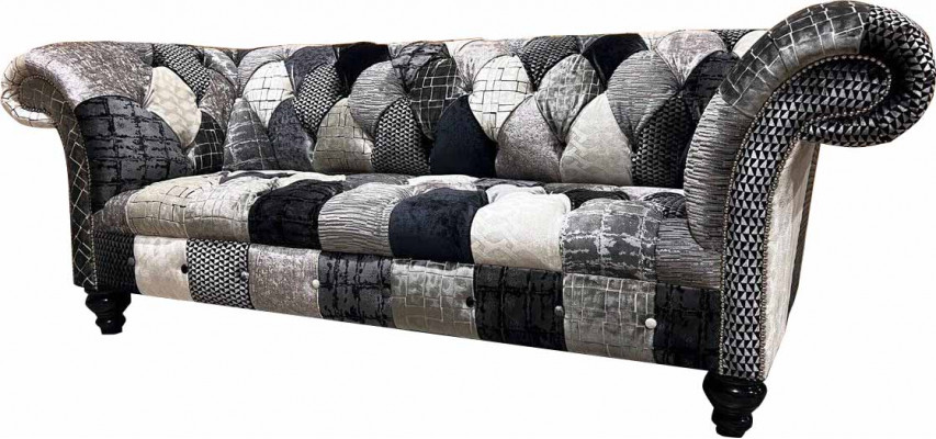 Luxurious velvet sofa in Chesterfield design with colorful checks