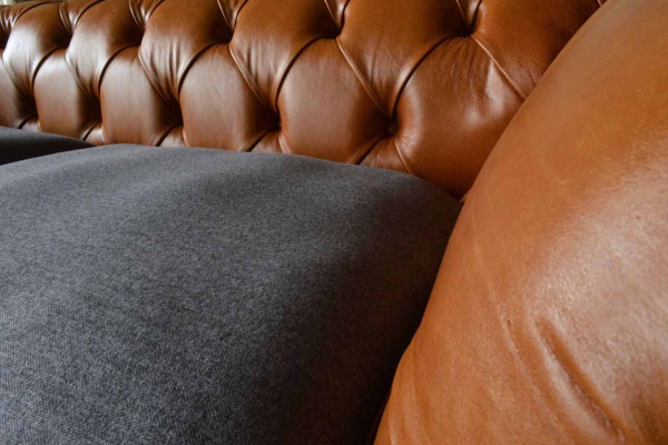 Luxurious faux leather sofa in Chesterfield 3-seater sofa design with three seats