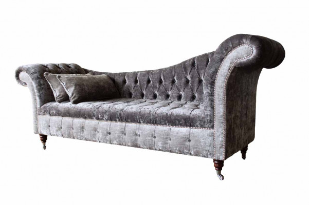 A luxurious, classic Chesterfield-style sofa in a rich silver tone.
