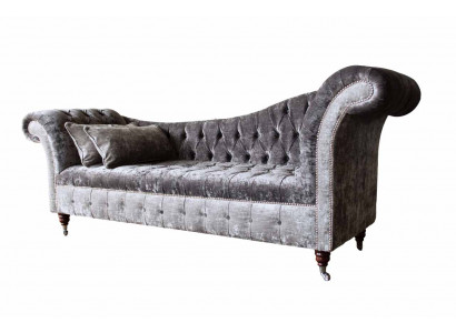 A luxurious, classic Chesterfield-style sofa in a rich silver tone.