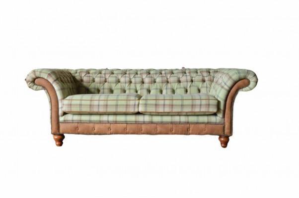 Luxurious designer sofa in Chesterfield design with three seats.