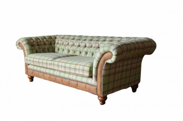 Luxurious designer sofa in Chesterfield design with three seats.