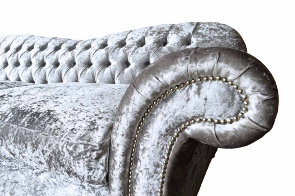 Luxurious classic gray three-seater Chesterfield sofa