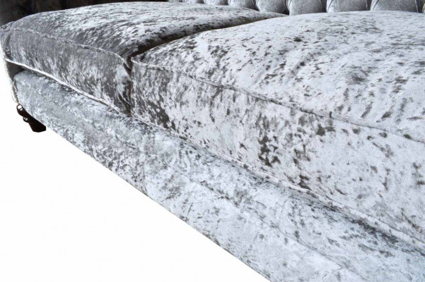 Luxurious classic gray three-seater Chesterfield sofa