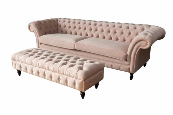 A luxurious pink four-seater sofa in Chesterfield design, including seat cushions