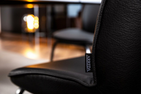 Laconic black chair in modern design for the dining room