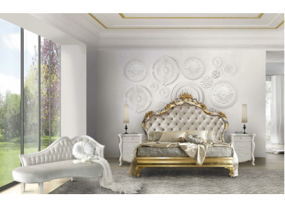 Beautiful bed in a classic style with a carved headboard.