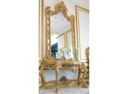 Luxurious carved console table and mirror in an elegant frame