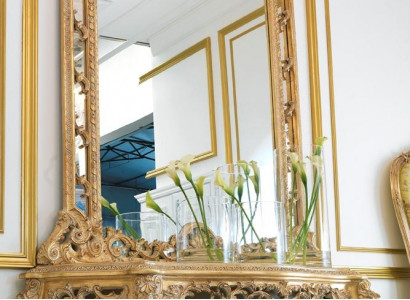 Luxurious carved console table and mirror in an elegant frame