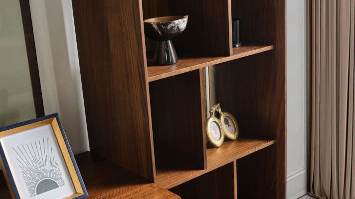 Stylish living room set consists of wall unit, coffee table, and side table.