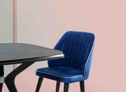 Blue upholstered chair with black wooden legs for dining room, light model