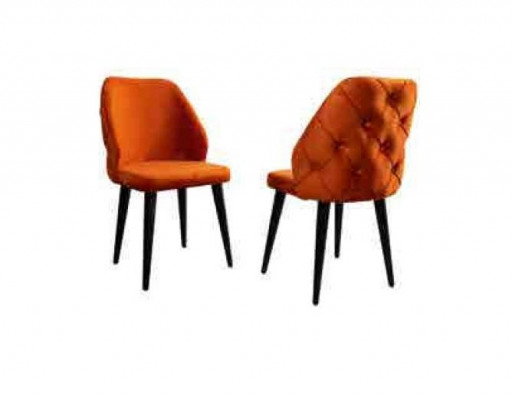 Padded orange Chesterfield wooden chair on black legs the dining room
