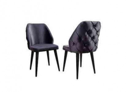 Padded gray wood chair, Chesterfield style, on black legs for dining room.