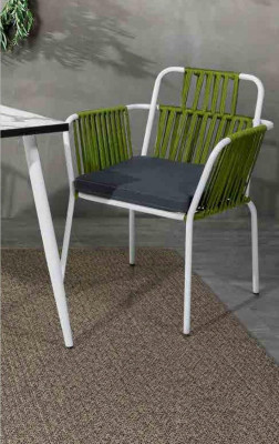 Original chair in light color on white legs with a soft seat cushion made of stainless steel.