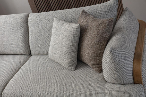 Luxurious 3-seater sofa, light color, modern furniture in living room