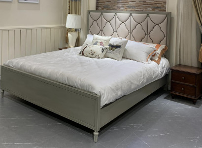 Premium double bed in classic design with beige leather upholstery