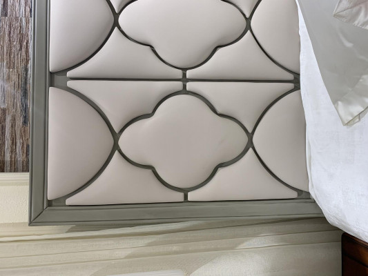 Premium double bed in classic design with beige leather upholstery