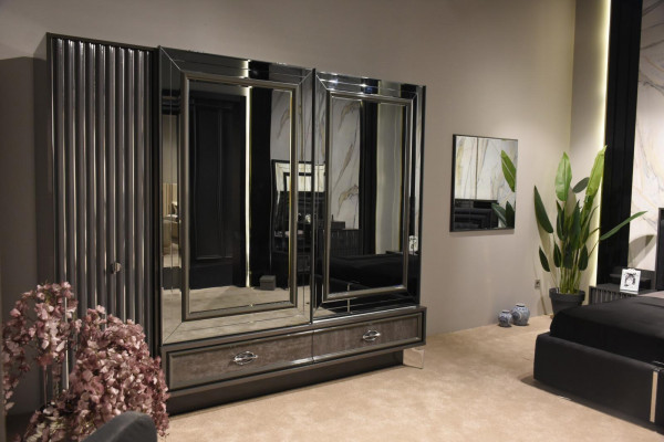 Designer wooden wardrobe with mirrored doors and drawers bedroom