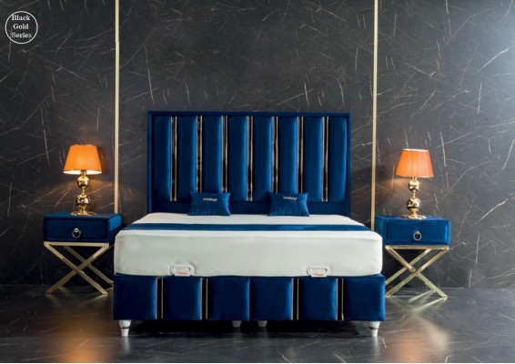 Sapphire blue designer bed with nightstands on gilded steel legs.