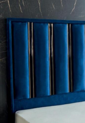 Sapphire blue designer bed with nightstands on gilded steel legs.
